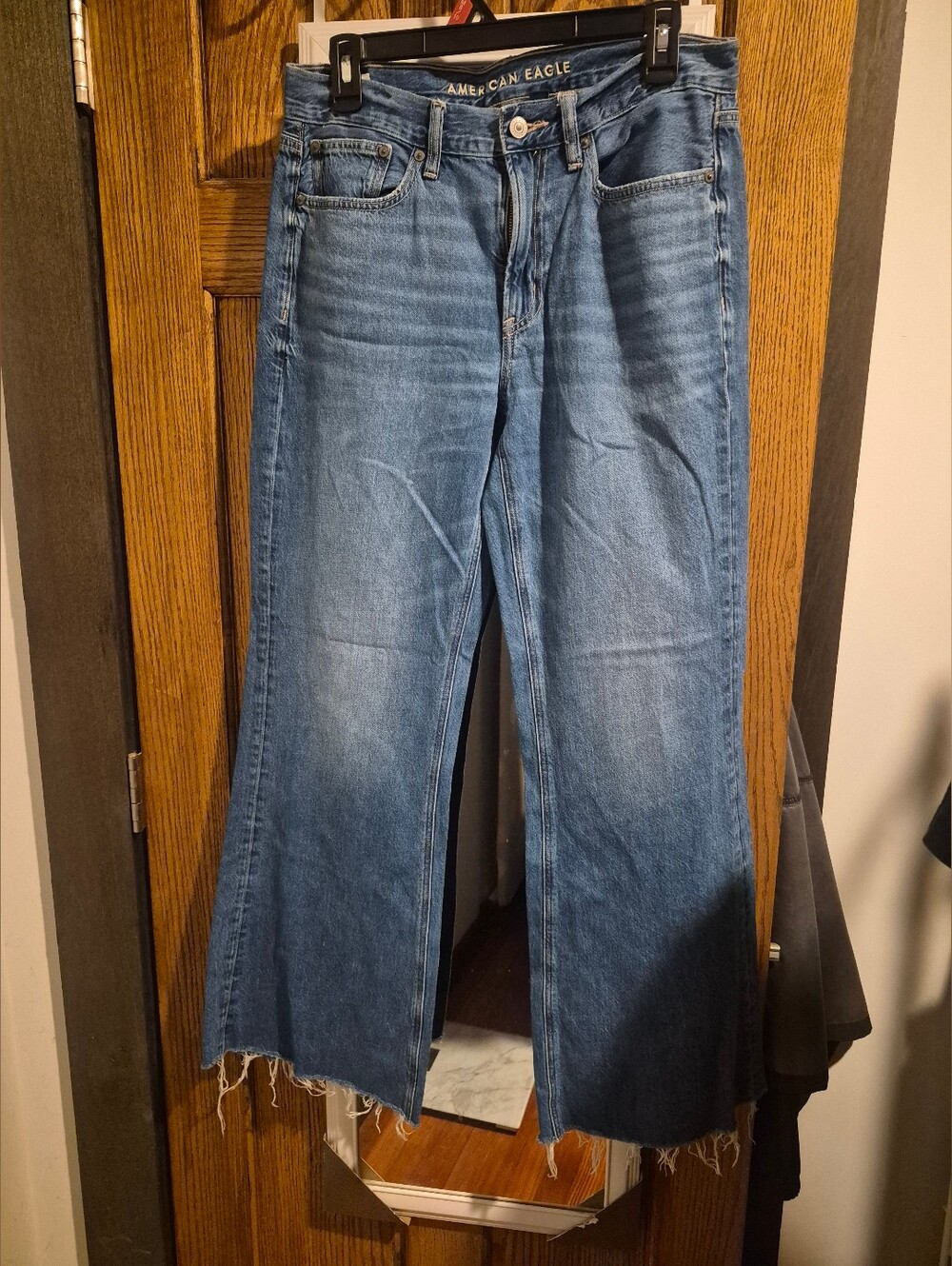American Eagle Low Rise Baggy Flare Jeans with Raw Hem